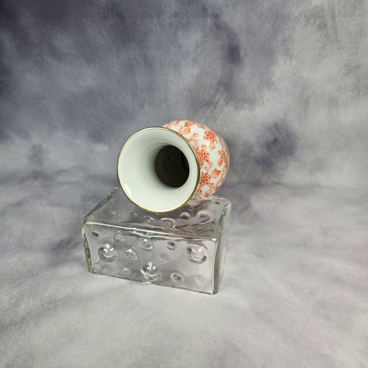 Rosenthal Vase mit orangen Blüten