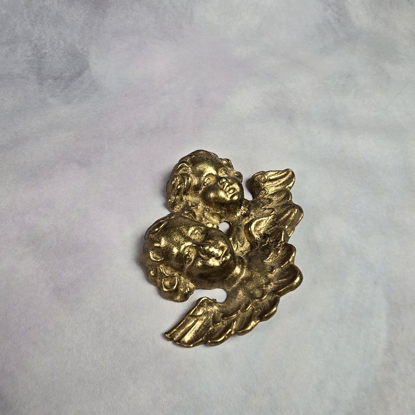 Putti - Engelsköpfe aus Messing