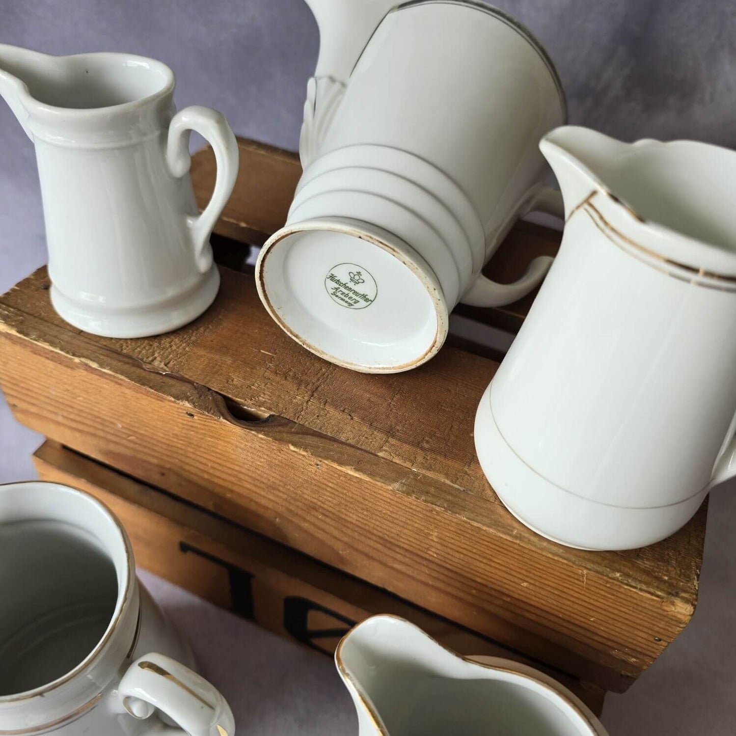 Set aus 5 antiken Milchkännchen