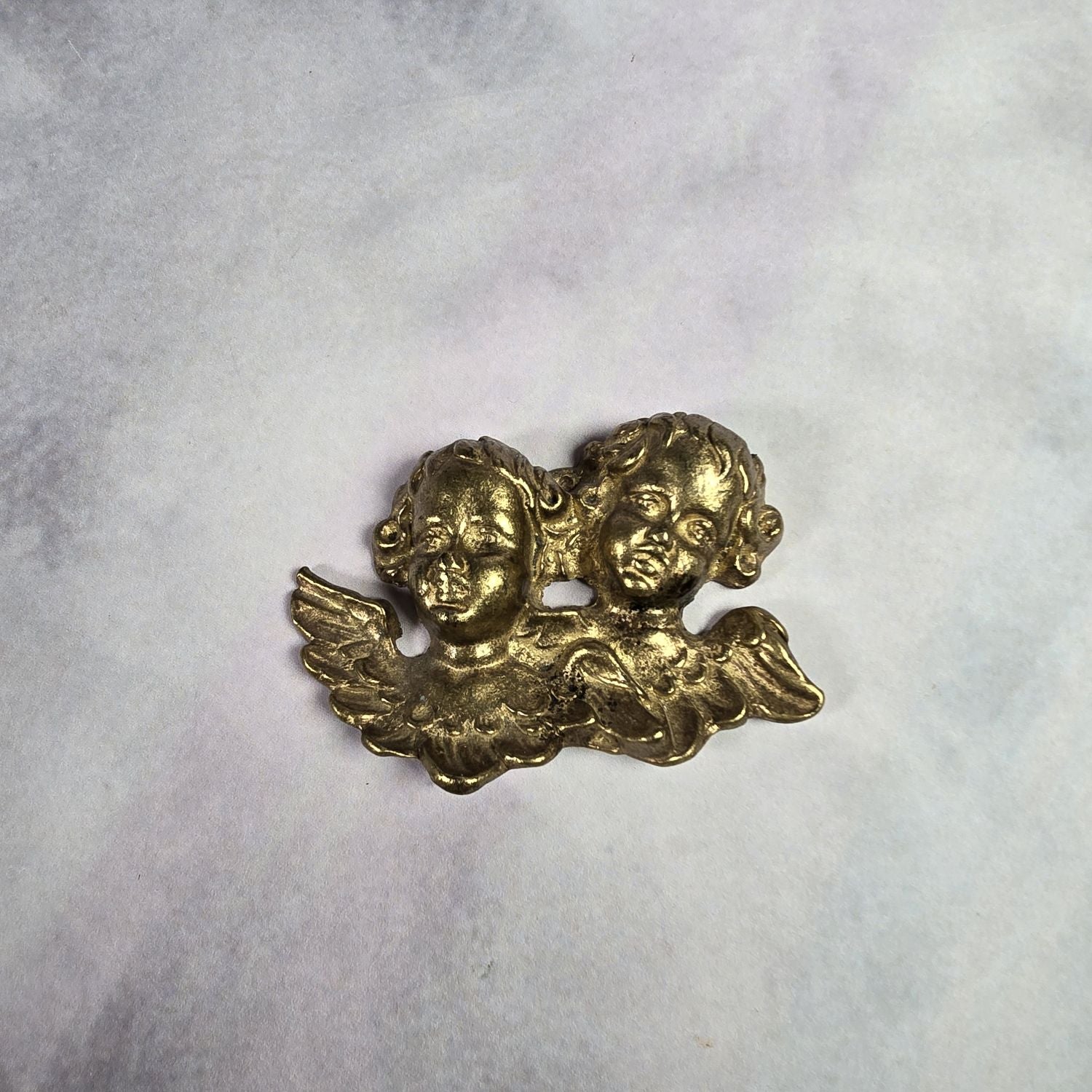 Putti - Engelsköpfe aus Messing